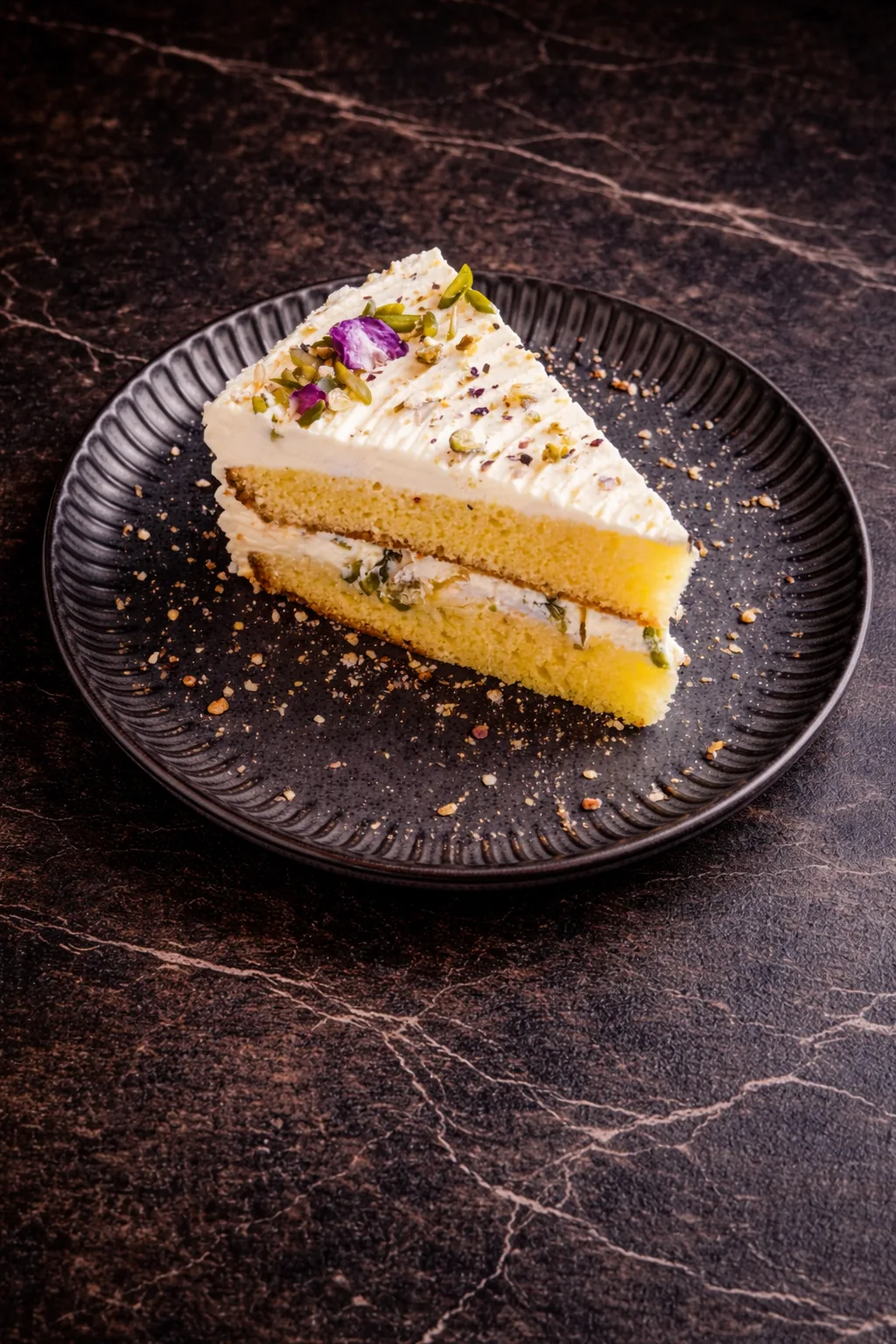 Saffron pistachio cake slice